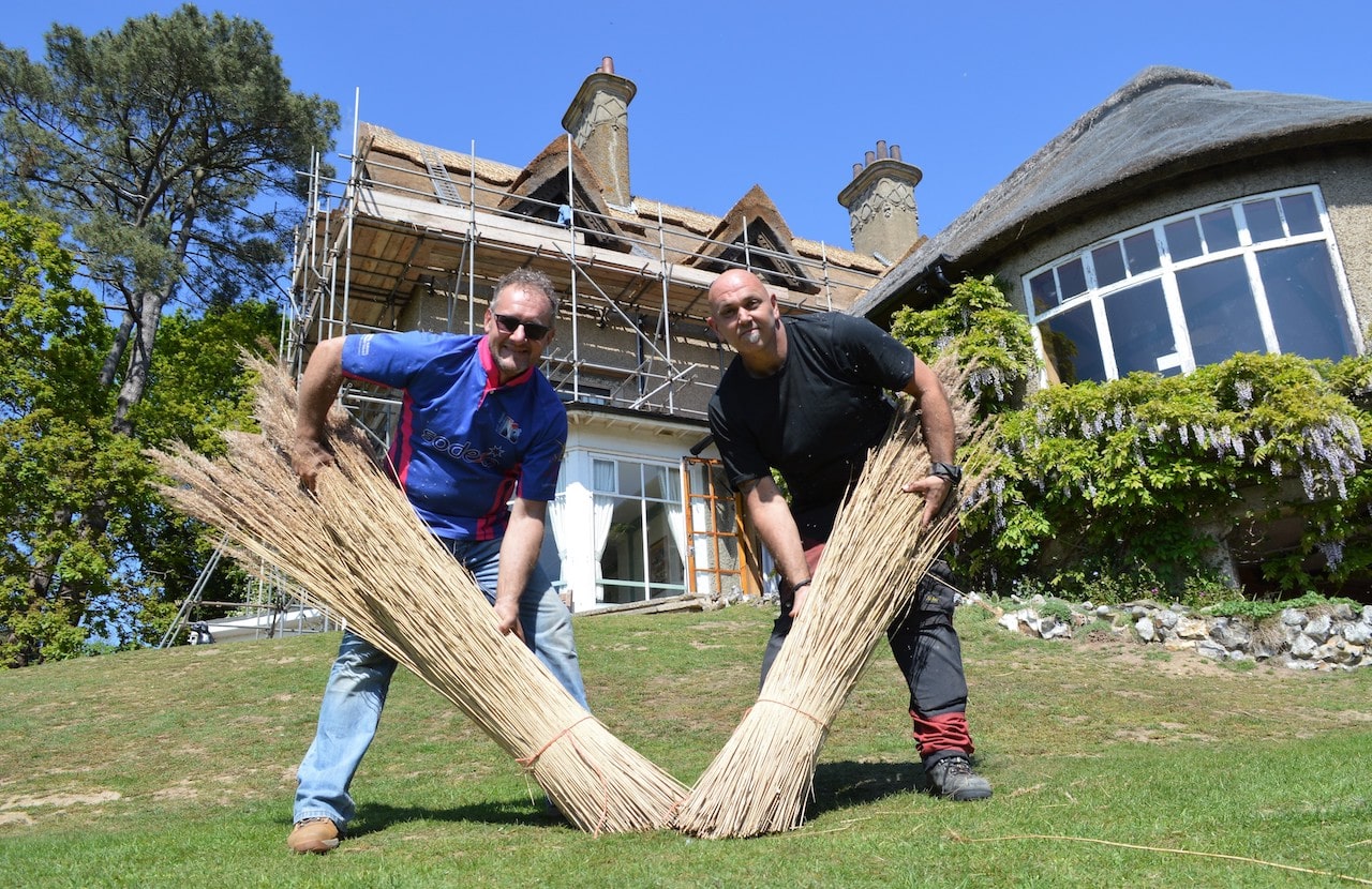 Thatchers Mick Aldred (left) and Leyton Rutherford at work at How Hill.-min Thatchers Mick Aldred (left) and Leyton Rutherford at work at How Hill