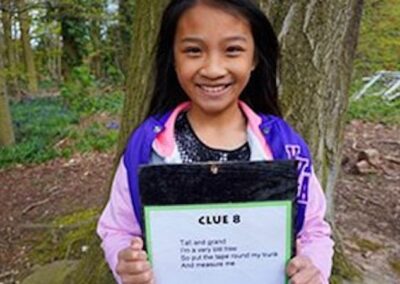Riddle Trail – Children work in small groups, solving nature-related riddles and finding clues to follow a trail set through the woods.